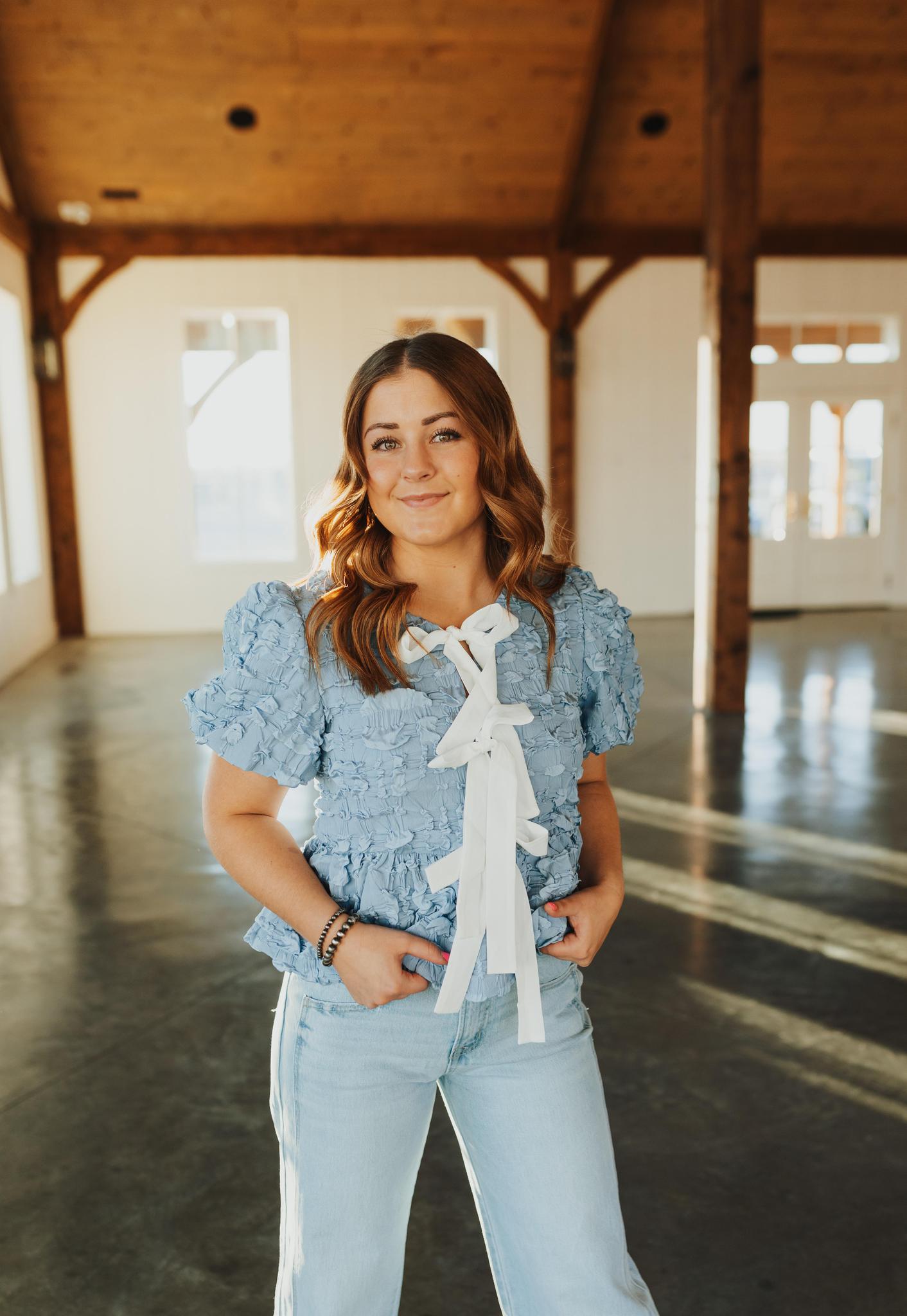 Bubble Babydoll Blouse with Textured Fabric and Contrast Bow - Lt. Blue