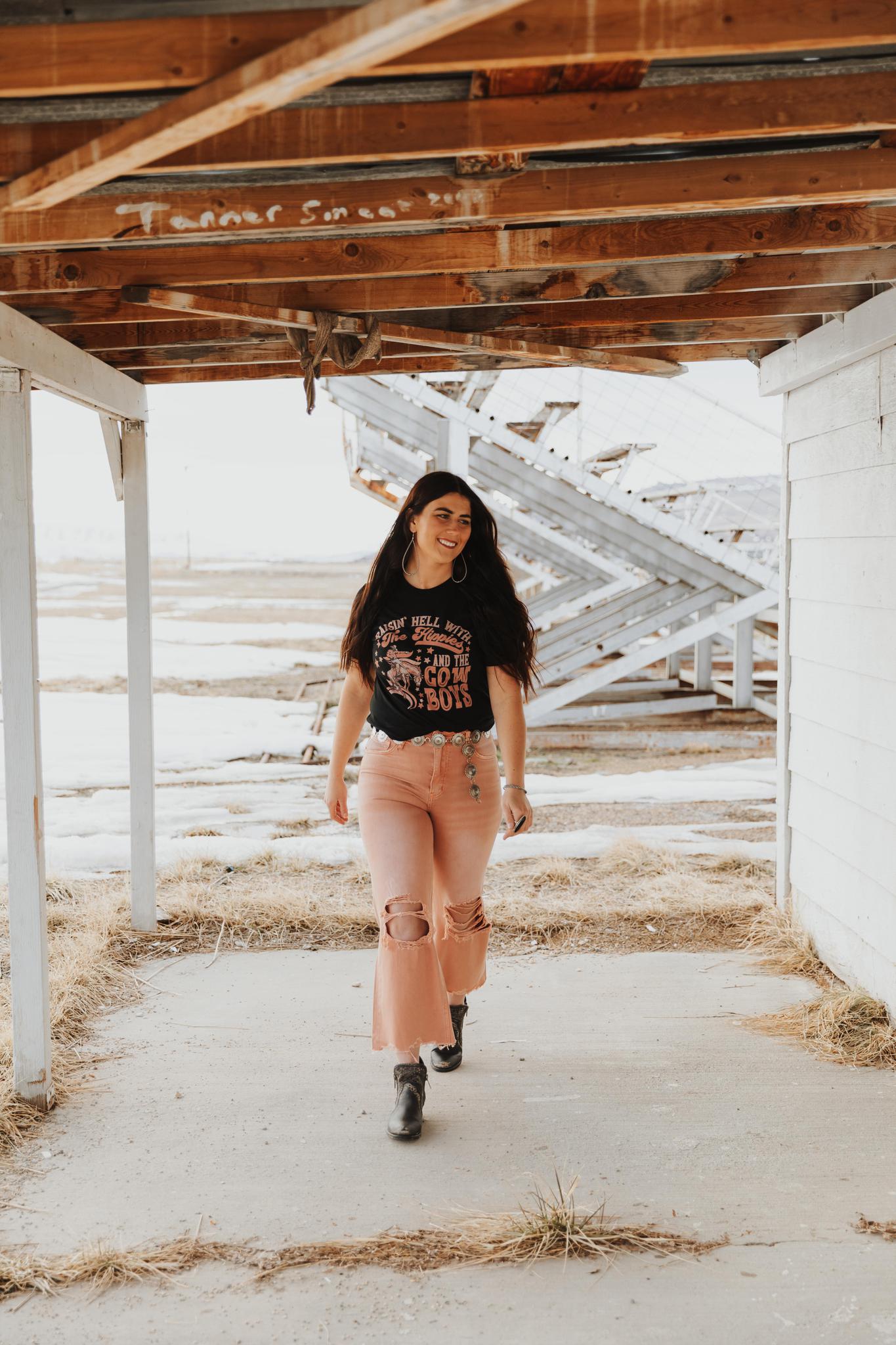 RAISIN HELL WITH THE HIPPIES & THE COWBOYS GRAPHIC TOP - BLACK
